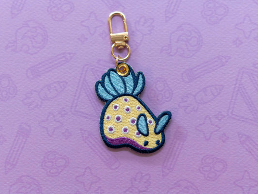 Kunies Nudi | Embroidered Charm